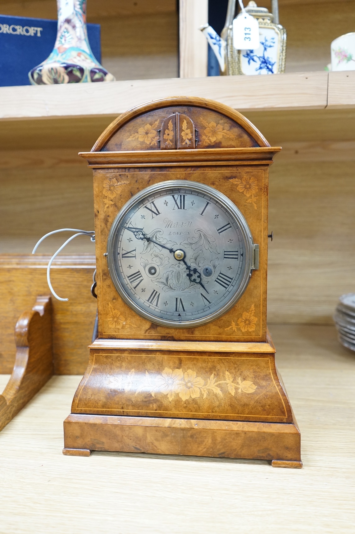 A Victorian burr walnut and marquetry dome topped cuckoo clock, signed Mitchell, London, with oak bracket, 41cm high